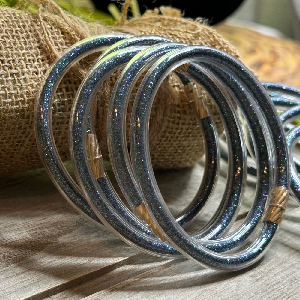 Set of 4 glitter jelly bangle bracelets in sparkling galaxy’s colors